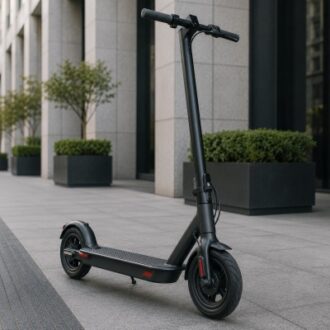 Black electric scooter on a clean urban walkway, showing a compact frame, standing deck and commuter mobility design.